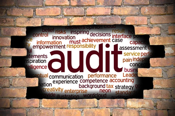 Hole at the brick wall with audit word cloud inside — Stock Photo, Image