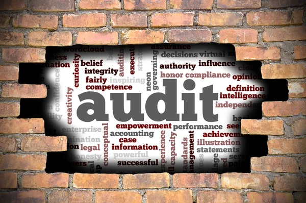 Hole at the brick wall with audit word cloud inside — Stock Photo, Image