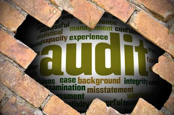 Hole at the brick wall with audit word cloud inside — Stock Photo, Image