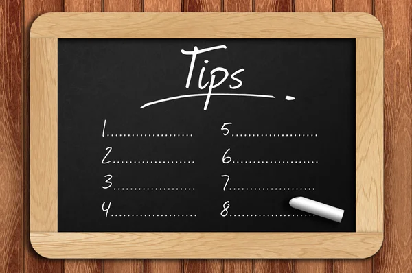 Chalkboard on the wooden table written tips list — Stock Photo, Image