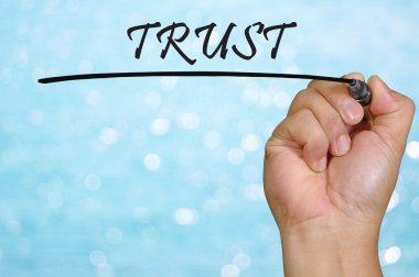 bokeh arka plan ve güven yazma el