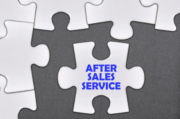 Jigsaw puzzle written word after sales service — Stock Photo, Image