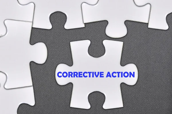 Puzzle mot écrit action corrective — Photo