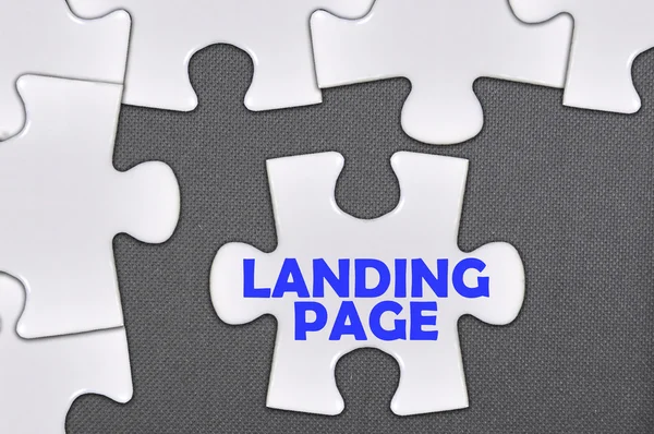Rompecabezas palabra escrita landing page —  Fotos de Stock