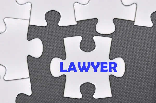 Jigsaw puzzle written word lawyer — стоковое фото