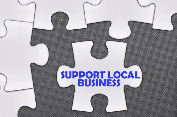 Jigsaw puzzle written word support local business — Stock Photo, Image