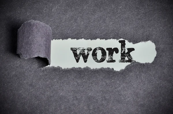 Work word under torn black sugar paper — Stock Photo, Image