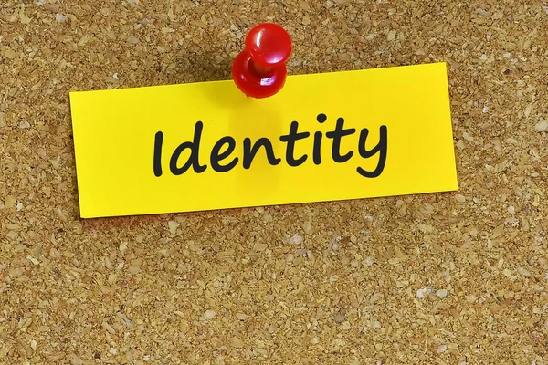 Parola d'identità su carta di note con sfondo di sughero — Foto Stock