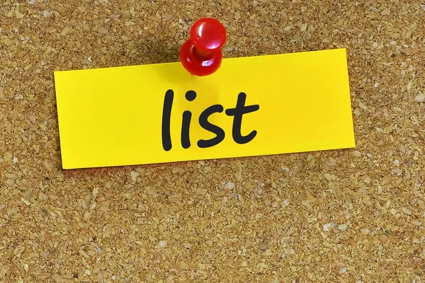 List  word on notes paper with cork background — Stock Photo, Image