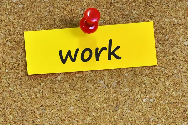 Work word di catatan kertas dengan latar cork — Stok Foto