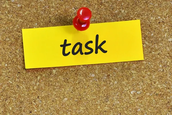 Task  word on notes paper with cork background — Stock Photo, Image