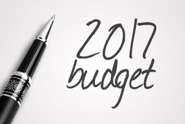 pen writes 2017  budget  on paper clipart