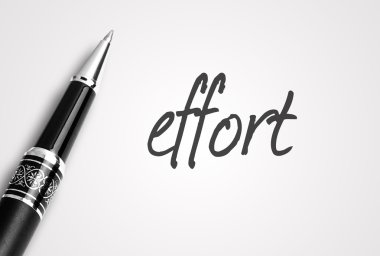 Kalem kağıt üzerinde çaba yazıyor 