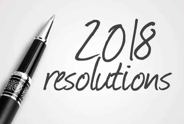 Caneta escreve resoluções 2018 no papel — Fotografia de Stock