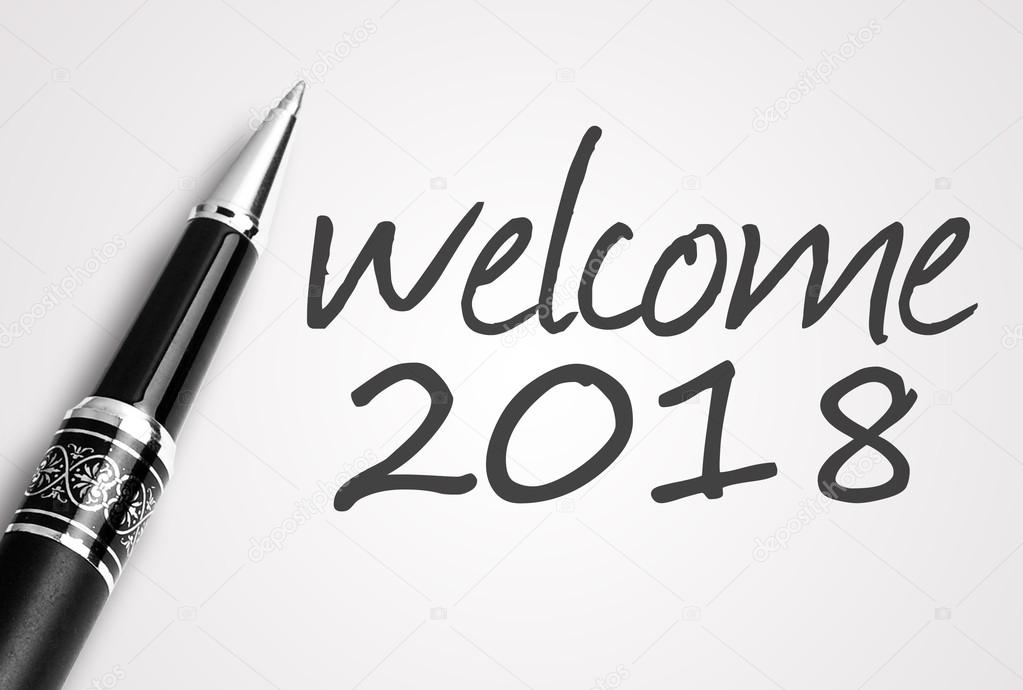 pen writes 2018 welcome on paper