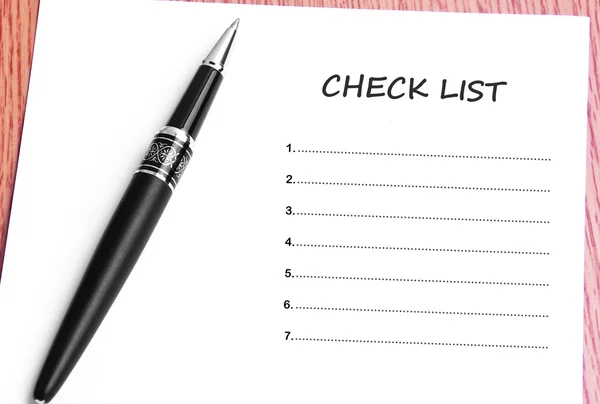 Pen  and notes paper with check list — Stock Photo, Image