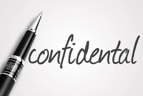 Pen writes confidental on white blank paper — Stock Photo, Image