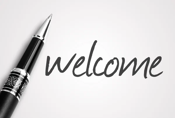 Pen writes welcome on white blank paper — Stock Photo, Image