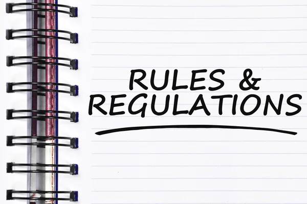 Rules & regulations words on spring white note book — Stock Photo, Image