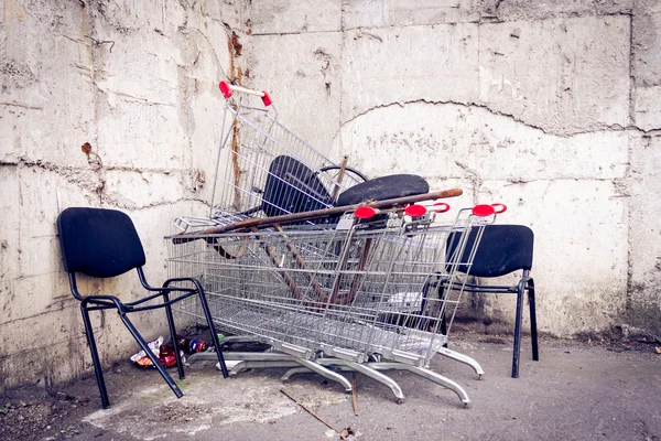 Abandoned chairs and carts