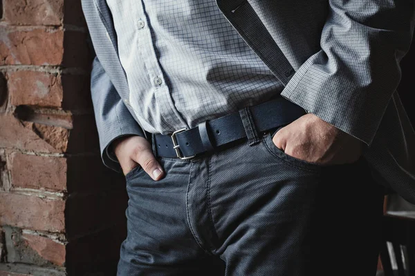 A business man in trousers with a leather belt — Stock Photo, Image