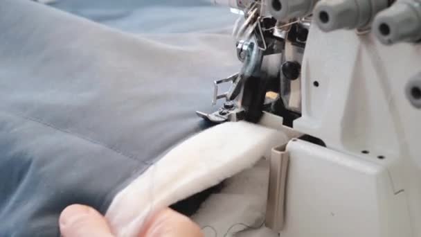 A close-up of the process of working in a sewing workshop — 비디오