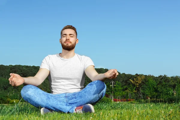 Young man resting in the park — Stock Photo, Image