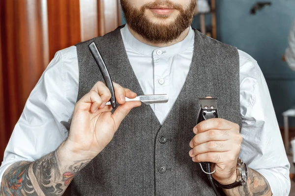 Barber testing the sharpness of a blade Stock Photo by ©photo_oles 80684356