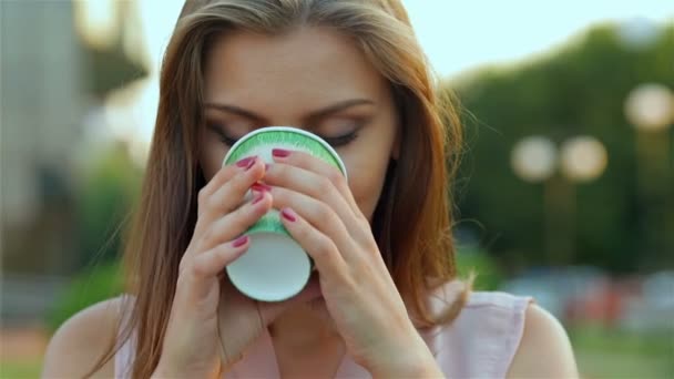 Beautiful girl drinking coffee — Stock Video