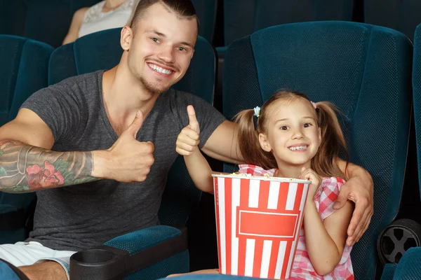 Thumbs up for interesting movie — Stock Photo, Image