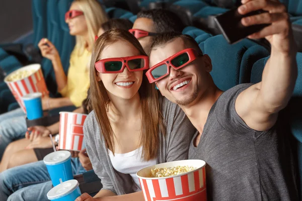 Two friends making selfie in the cinema — Stock Photo, Image