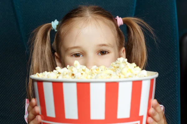 Adorable little girl with popcorn — Stock Photo, Image