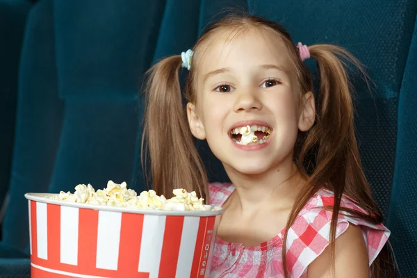 Adorable little girl with popcorn — Stock Photo, Image