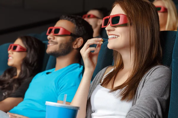 Friends watching 3D movie in the cinema — Stock Photo, Image