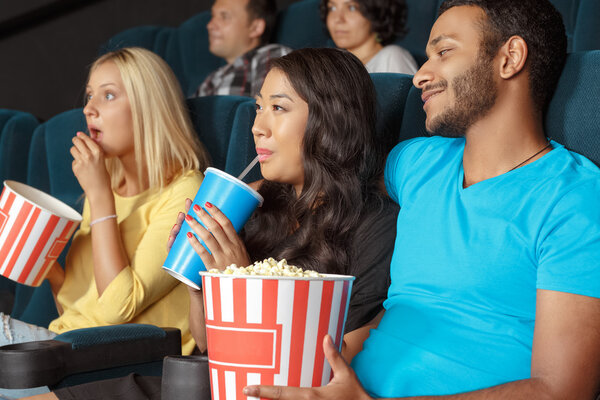 Young couple at the movie theatre