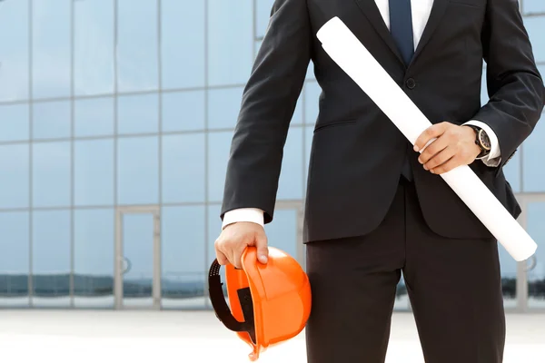 Successful architect with hardhat and plueprints — Stock Photo, Image