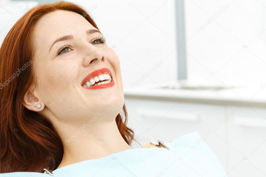 Beautiful girl on the dental chair