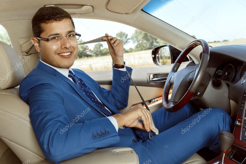 Businessman driving his car