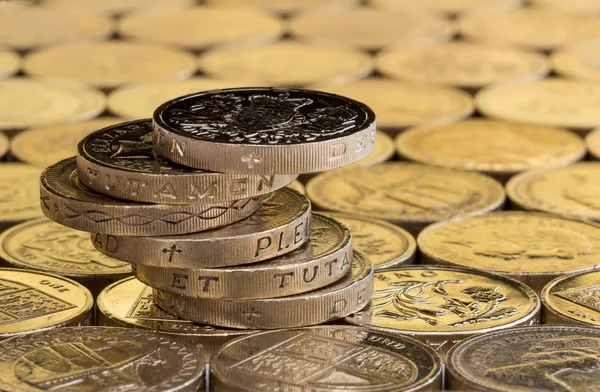 British pound coins in an untidy staggered stack. — Stock Photo, Image