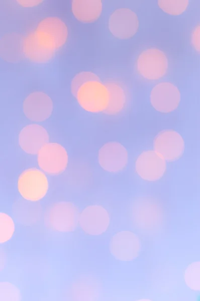 Bokeh ışıklar arka plan. Uçuk mavi ve şeftali.