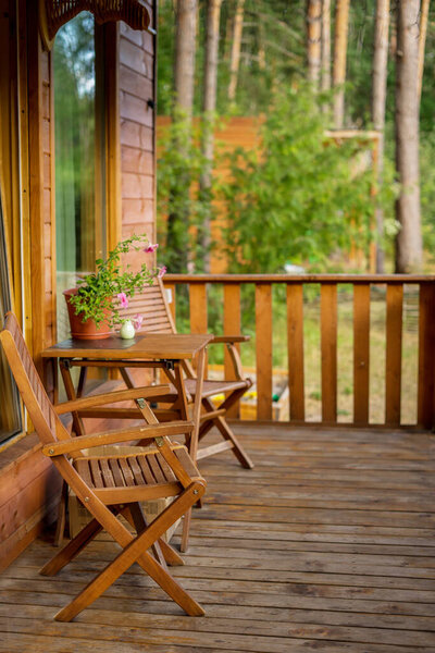 Terrace with table and chairs and garland of lights. High quality photo