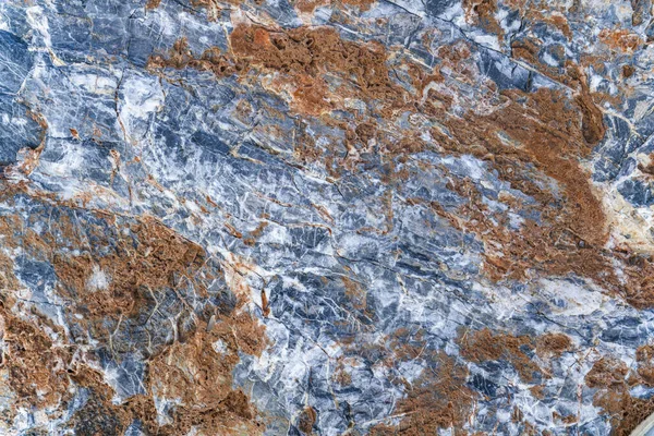 Textur av sten platta med grå-orange mönster. Stockbild