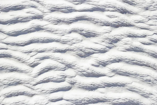 Textur av Pamukkale kalciumtravertin, vitt mönster av horisontella vågor Royaltyfria Stockfoton