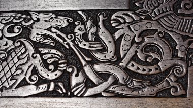 Viking wood carving of a wolf clipart