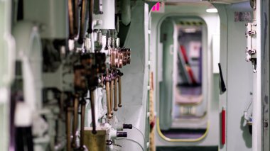 Inside the claustrophobic hull of a US naval ship clipart