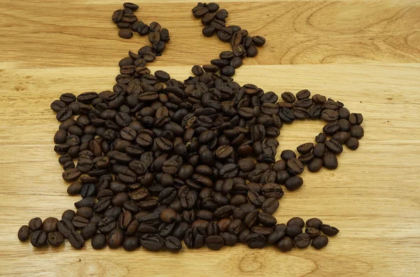 Granos de café en imagen de estilo taza — Foto de Stock