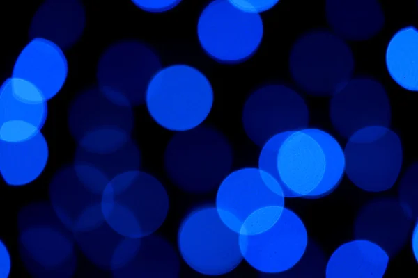 Abstract blue bokeh on black background — Stock Photo, Image