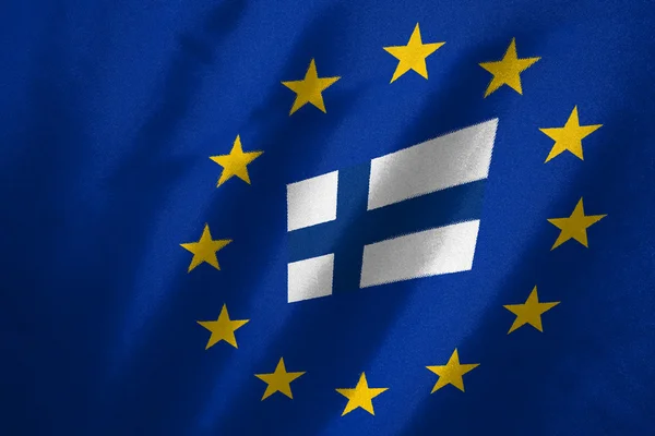 Finland flag in EU flag on fabric — Stock Photo, Image