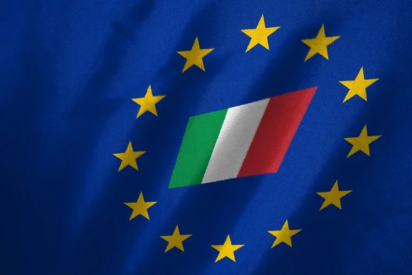 Italy flag in EU flag on fabric — Stock Photo, Image