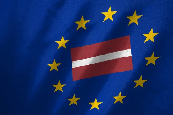 Latvia flag in EU flag on fabric — Stock Photo, Image